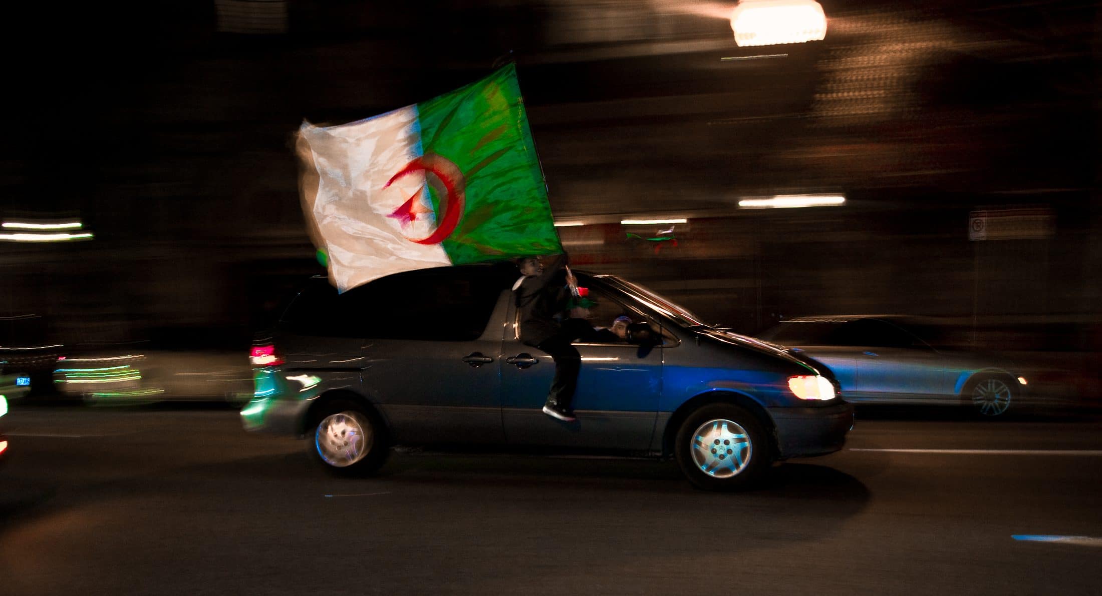 A fan waving a national flag